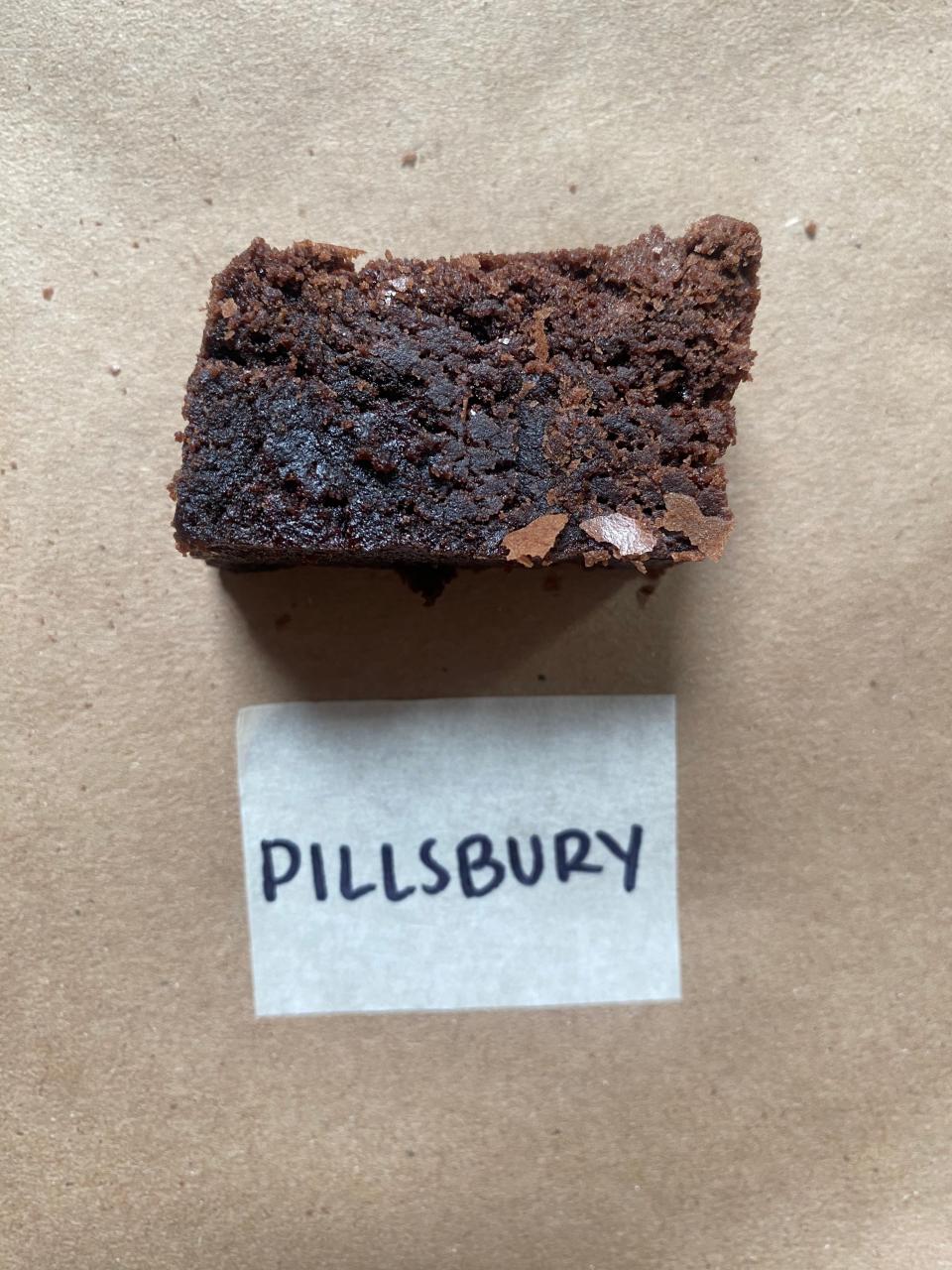 A close-up of a chocolate brownie with a 