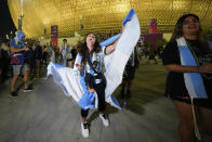 A supporter of Argentina celebrates outside Lusail Stadium following their team's 2-0 victory over Mexico in a World Cup group C soccer match in Lusail, Qatar, Saturday, Nov. 26, 2022. (AP Photo/Julio Cortez)