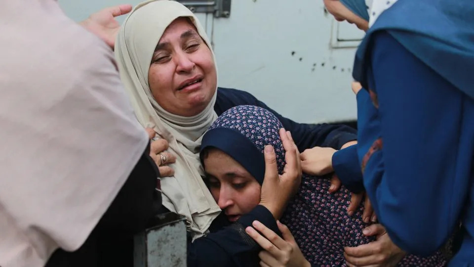 Palestinians mourn relatives killed in an Israeli bombardment in the Bureij area of central Gaza on June 4, 2024. - Bashar Taleb/AFP via Getty Images