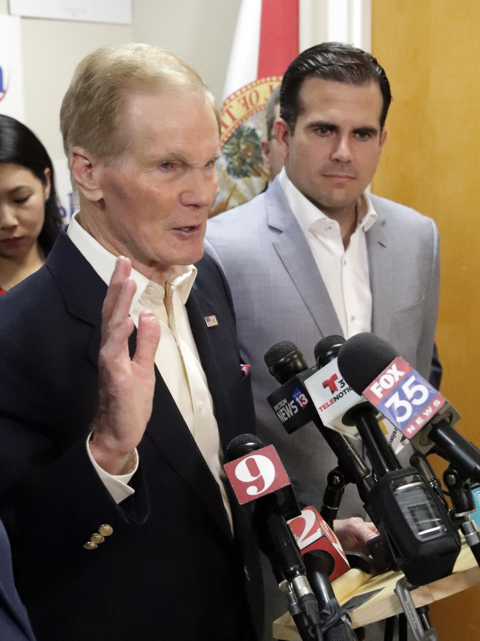 U.S. Sen. Bill Nelson, left, speaks to supporters and members of the media after he was endorsed by Puerto Rico Governor Ricardo Rossello, right, during a news conference Monday Oct. 1, 2018, in Orlando, Fla. (AP Photo/John Raoux)