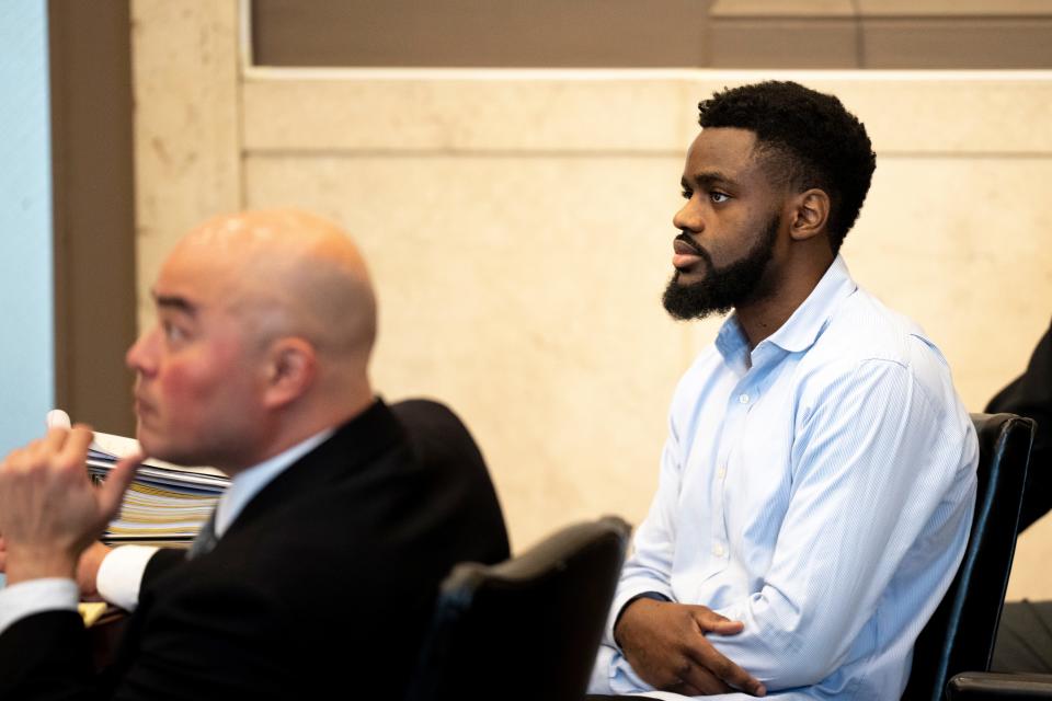 Carl Godfrey, 23, looks on during opening statements in his murder trial at the Hamilton County Justice Center in Cincinnati on Tuesday, Jan. 23, 2024.