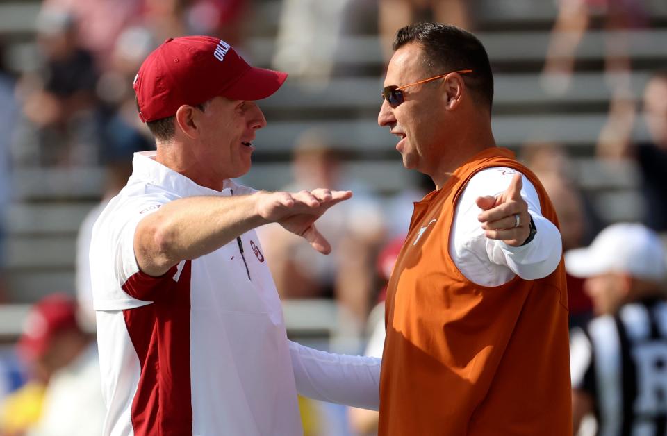 Oct 8, 2022; Dallas, Texas, USA;  Oklahoma Sooners head coach Brent Venables (left) speaks with Texas Longhorns head coach Steve Sarkisian (right) before the game at the Cotton Bowl. Mandatory Credit: Kevin Jairaj-USA TODAY Sports