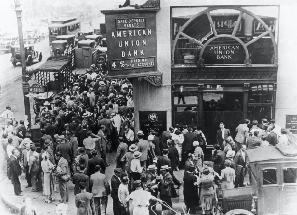 Thousands of banks failed in the Great Depression. <a href="https://www.gettyimages.com/detail/news-photo/depositors-congregate-outside-the-state-ordered-closed-news-photo/514877484" rel="nofollow noopener" target="_blank" data-ylk="slk:Bettmann via Getty Images;elm:context_link;itc:0;sec:content-canvas" class="link ">Bettmann via Getty Images</a>