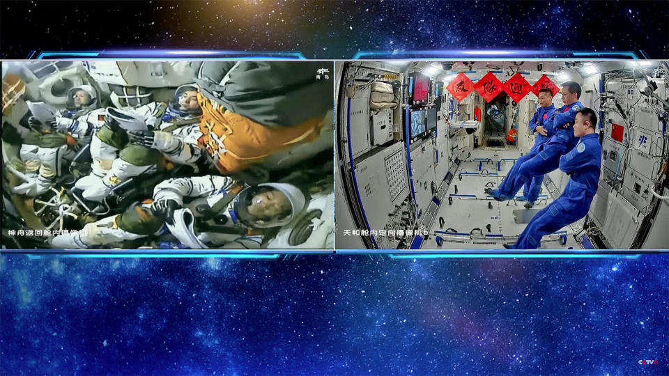 The Shenzhou 18 crew (left) monitors cockpit displays during the climb to space while the Shenzhou 17 crew they are replacing watches the ascent from the Tiangong space station. / Credit: CCTV