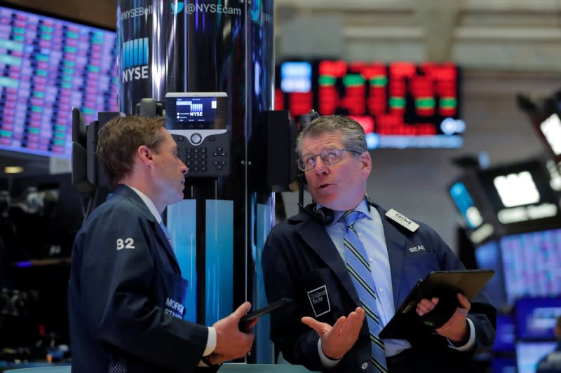 Traders work on the floor of the New York Stock Exchange (NYSE) in New York