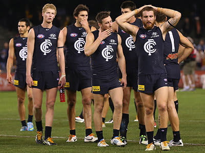 The Blues look dejected after losing the round 12 AFL match between the Carlton Blues and the Hawthorn Hawks at Etihad Stadium on June 14, 2013 in Melbourne, Australia.