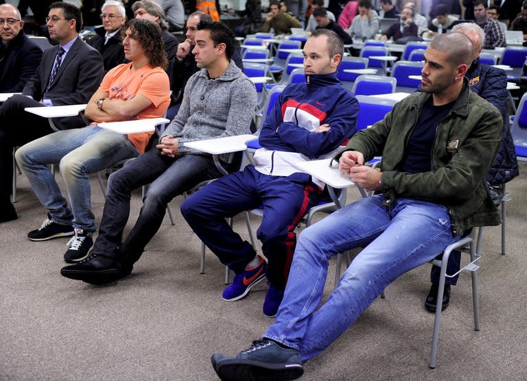 (From L) Barcelona's players, Carles Puyol, Xavi Hernandez, Andres Iniesta and Victor Valdes attend a press conference called by Barcelona's president Sandro Rosell about coach Tito Vilanova, at the club's Sports Center Joan Gamper in St Joan Despi, near Barcelona, on December 19, 2012. It was revealed Vilanova has suffered a relapse of a tumour on which he was operated just over a year ago