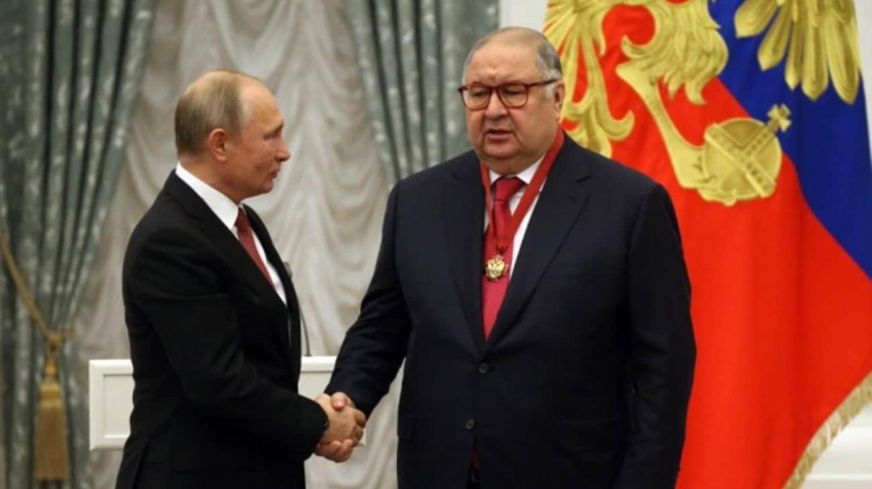 Putin and Usmanov. Photo: Getty Images