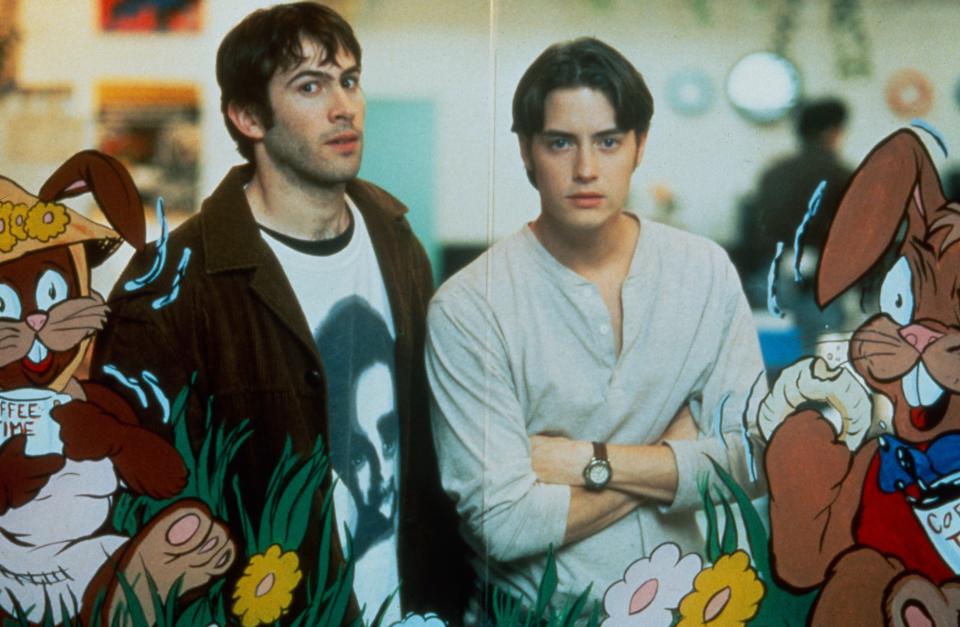 Jason Lee and Jeremy London look at the camera from behind a rabbit display