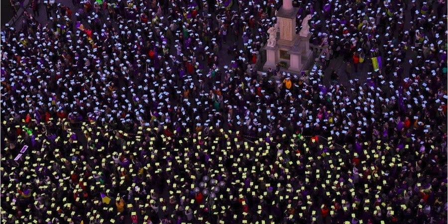 Participants of the action in Prague on the second anniversary of the full-scale Russian invasion of Ukraine raised yellow and blue flags