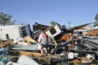 Sharon Odom looks over what is left of her RV at the Roadrunner RV Park in Oklahoma City, Oklahoma May 7, 2015. About a dozen people were injured by a series of tornadoes that touched down southwest of Oklahoma City, part of a storm system that flattened structures and caused severe flooding in several Great Plain states, officials said on Thursday. REUTERS/Nick Oxford TPX IMAGES OF THE DAY