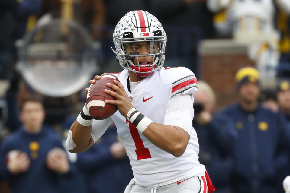 Ohio State quarterback Justin Fields throws against Michigan in the first half of an NCAA college football game in Ann Arbor, Mich., Saturday, Nov. 30, 2019. (AP Photo/Paul Sancya)