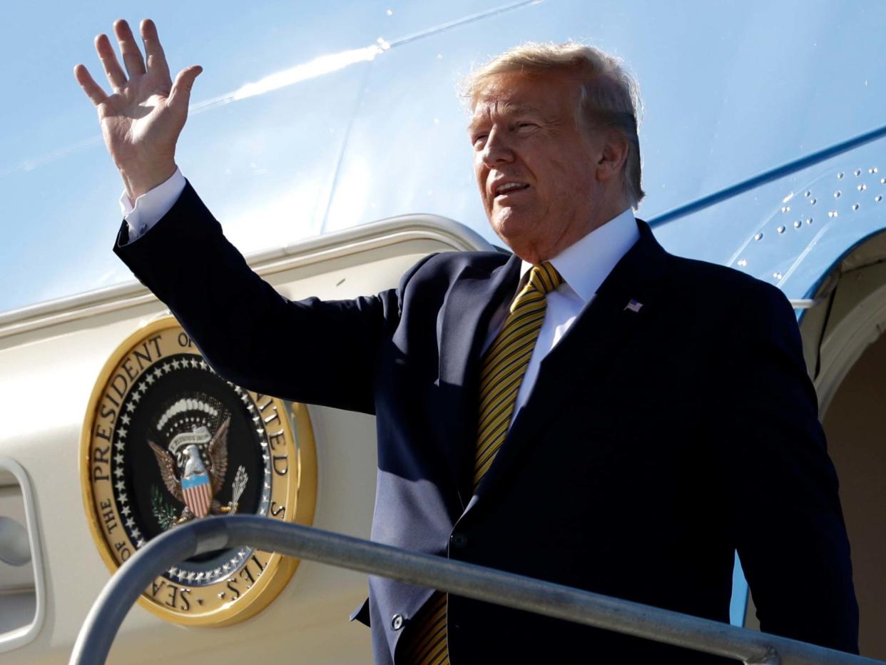 Donald Trump arrives at Los Angeles International Airport to attend a fundraiser: Evan Vucci/AP