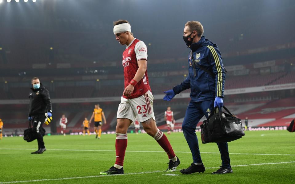 David Luiz of Arsenal with Arsenal Physio Jordan Reece during the Premier League match between Arsenal and Wolverhampton Wanderers  - Getty Images
