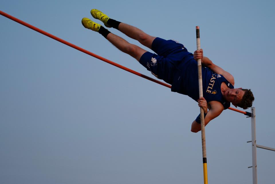 Castle's AJ Lothamer clears 12' 6" in the pole vault during the IHSAA Boys Sectional 32 Track and Field Meet at Central Stadium Thursday evening, May 18, 2023. It was the winning jump, but Lothamer eventually cleared 13' 7".