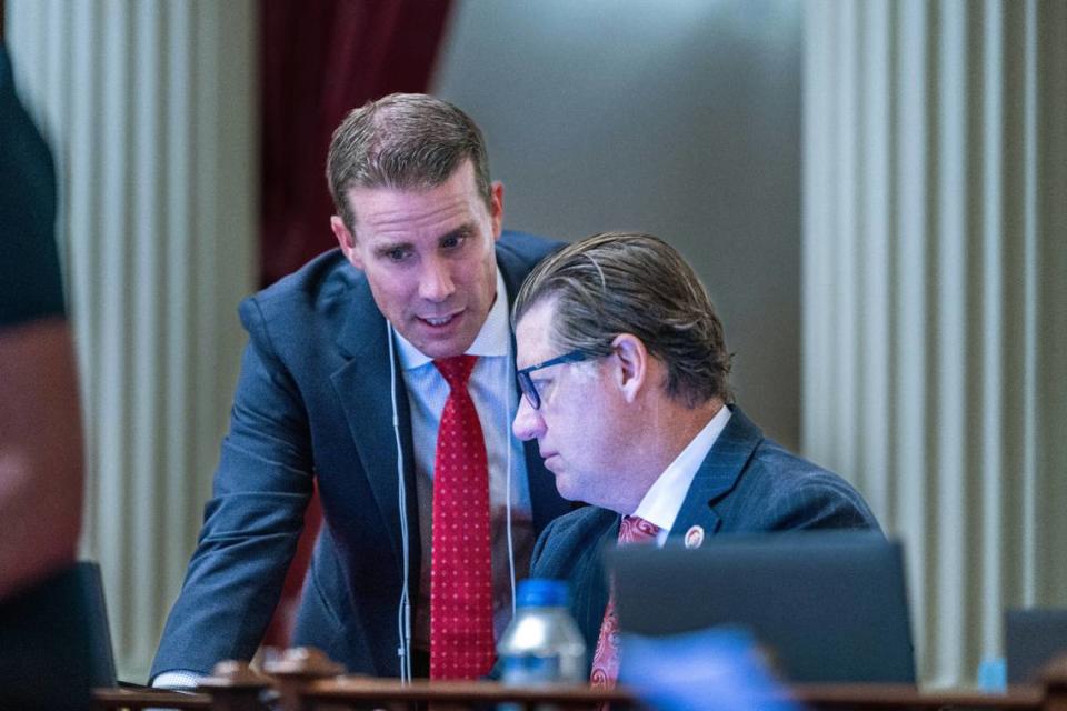 Senate President Pro Tem-designee Mike McGuire, D-Healdsburg, talks with Senate Minority Leader Brian Jones, R-San Diego, in September.