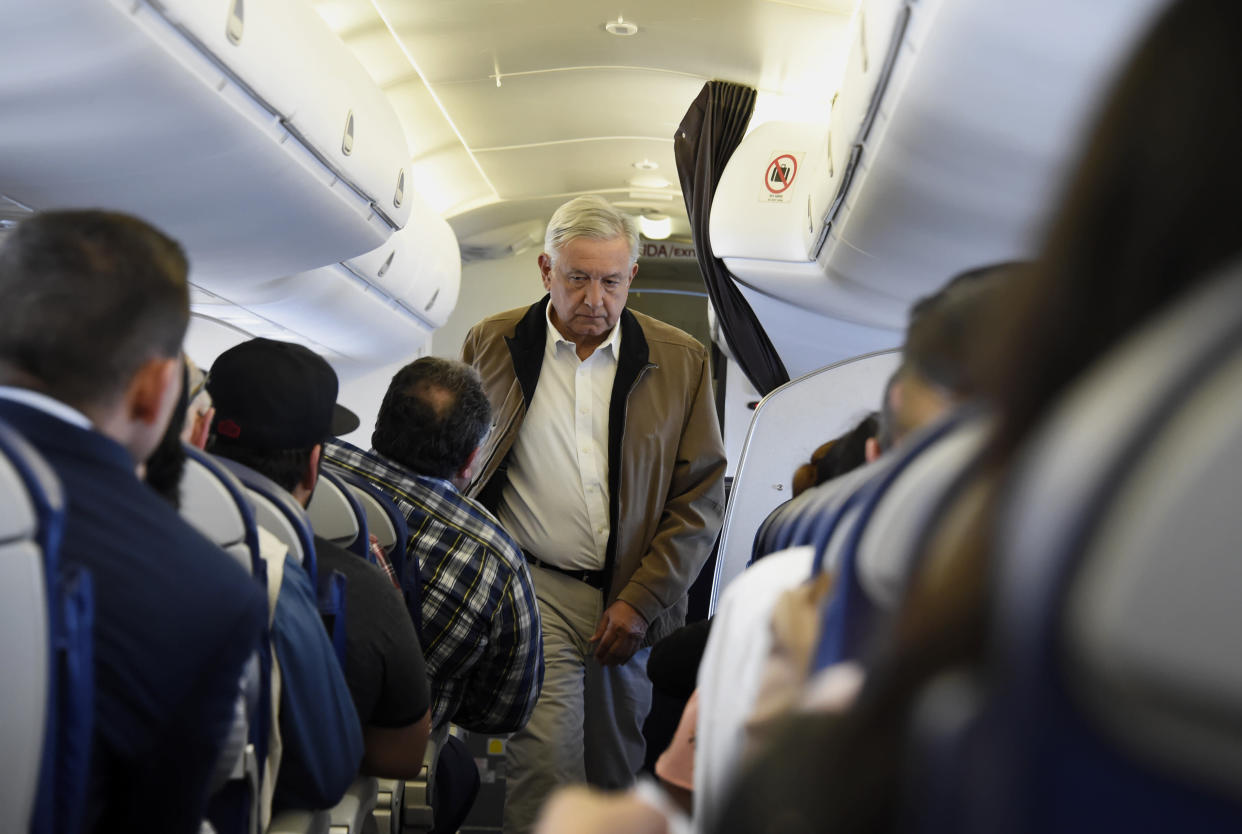 Mexican President Andres Manuel Lopez Obrador boards a commercial flight bound for Culiacan, at Mexico City's international airport, on February 15, 2019. - Anti-establishment Lopez Obrador adpoted aggressive austerity measures for his government, including slashing his own salary, disbanding the presidential security detail and flying commercial airlines for official trips. (Photo by Alfredo ESTRELLA / AFP)        (Photo credit should read ALFREDO ESTRELLA/AFP/Getty Images)