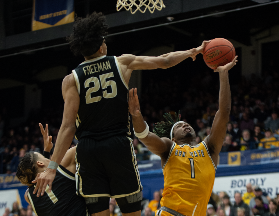 Akron senior Enrique Freeman blocks the shot of VonCameron Davis of Kent State during a college basketball game on Jan. 19, 2024.