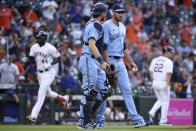 Toronto Blue Jays starting pitcher Steven Matz, right, and catcher Danny Jansen walk to the mound as Houston Astros' Yordan Alvarez, back left, runs the bases after hitting a two-run home run during the fourth inning of a baseball game Saturday, May 8, 2021, in Houston. (AP Photo/Eric Christian Smith)