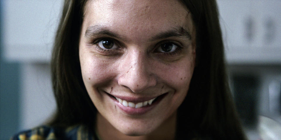 This image released by Paramount Pictures shows Caitlin Stasey in a scene from "Smile." (Paramount Pictures via AP)