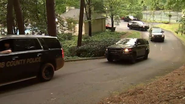 PHOTO: Cobb County police patrol units drive near the complex where the Atlanta shooting suspect was apprehended, on May 3, 2023. (WSB)