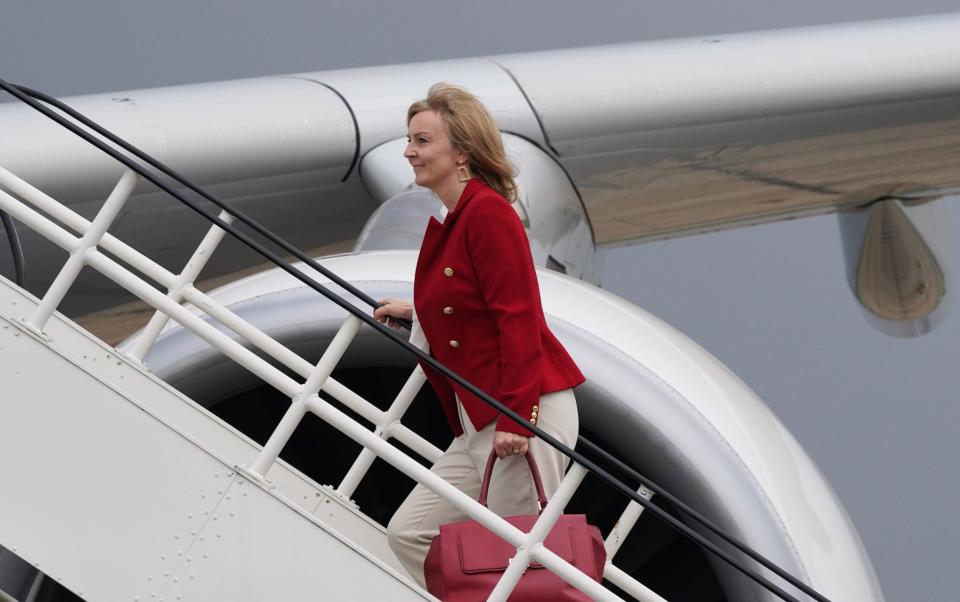 Liz Truss boards the flight to the US in her first outing as Foreign Secretary - Stefan Rousseau/PA Wire