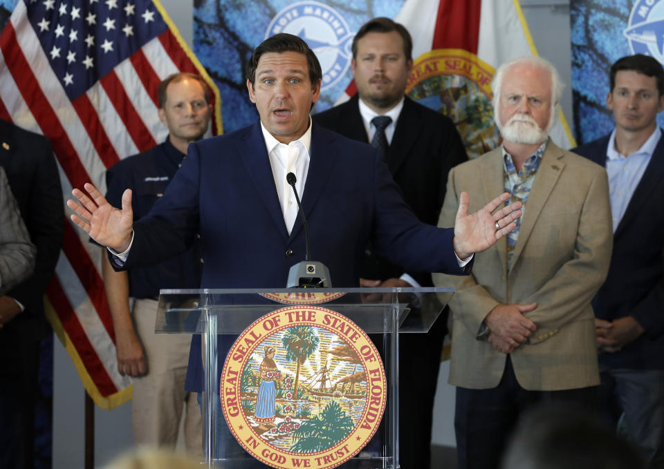 Florida Gov. Ron DeSantis speaks after signing a red tide mitigation and technology development initiative into law during a news conference at Mote Marine Laboratory Thursday, June 20, 2019, in Sarasota, Fla. DeSantis says Florida will commit $3 million for the next five years for the purpose of prioritizing red tide prevention. (AP Photo/Chris O'Meara)