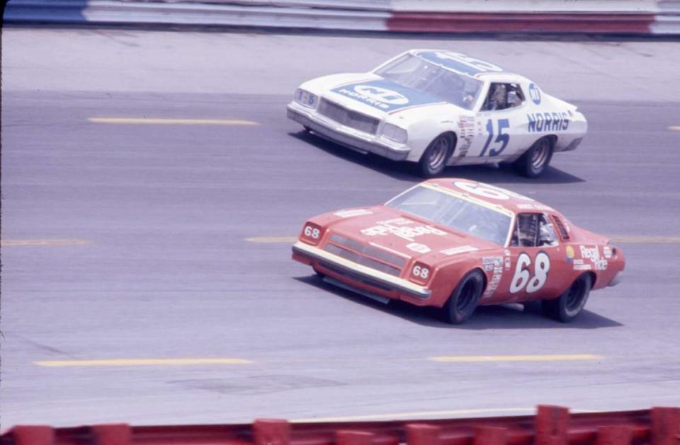 Janet Guthrie (68) races against Buddy Baker (15) in the 1976 World 600. Guthrie would finish 15th in her first-ever NASCAR race.