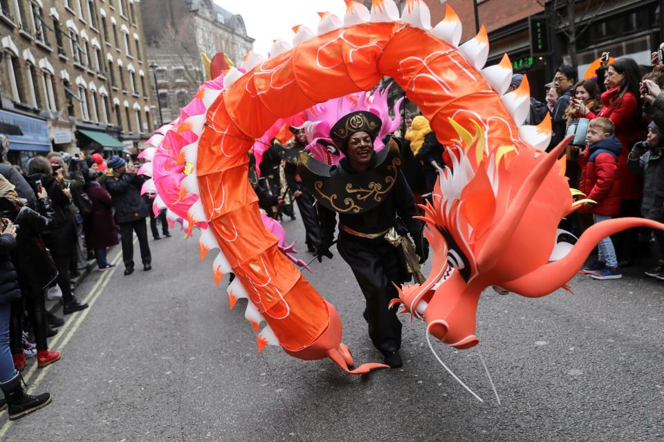 Performers take part in the Chinese Lunar New Year parade through central London (REUTERS)