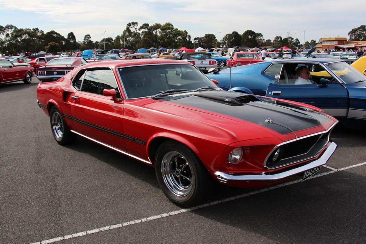 1969 Ford Mustang Mach 1 Sportsroof Candyapple Red. The 1969 Mustang got a new body, nearly 4 inches longer than the 1968 model. The Fastback was now called the Sportsroof and the sporty model was now the Mach 1, it got sports suspension, reflective stri