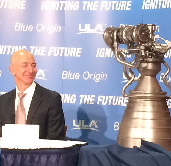 Jeff Bezos looks on as a new model of Blue Origin's BE-4 liquid rocket engine is revealed during a press event on Sept. 17, 2014.