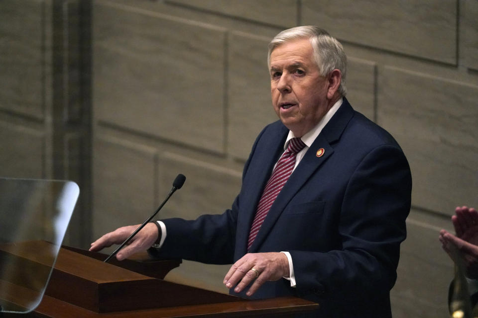 FILE - In this Jan. 27, 2021 file photo, Missouri Gov. Mike Parson delivers the State of the State address in Jefferson City, Mo. Federal officials are pushing back after Parson said he doesn't want government employees going door-to-door to urge people to get vaccinated. Missouri asked for help last week from nearly formed federal "surge response" teams as it combats an influx of cases that's overwhelming some hospitals. (AP Photo/Jeff Roberson, File)