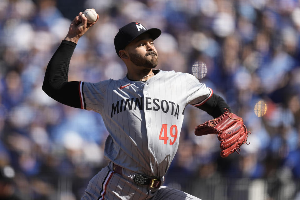 Minnesota Twins starting pitcher Pablo Lopez throws during the first inning of a baseball game against the Kansas City Royals Thursday, March 28, 2024, in Kansas City, Mo. (AP Photo/Charlie Riedel)