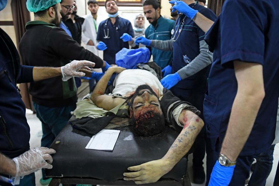 <p>A wounded man lies at a hospital following a deadly earthquake that shook Syria at dawn on February 6, 2023 in Aleppo's Salaheddine district. - At least 810 people were killed in Syria as buildings collapsed after a 7.8 magnitude earthquake struck neighbouring Turkey, state media and rescuers said. (Photo by AFP) (Photo by -/AFP via Getty Images)</p> 