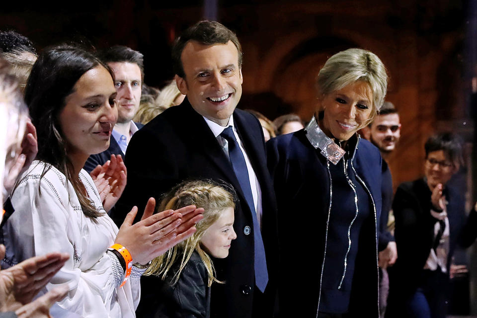 <p>French president-elect Emmanuel Macron celebrates on stage with wife Brigitte Trogneux during his victory rally near the Louvre museum in Paris, May 7, 2017. (Thomas Samson/Pool/Reuters) </p>