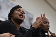 Taneisha Jointer, left, mother of Sacred Heart Academy guard ZaKiyah Johnson, watches her daughter during a high school basketball game against Mercy Academy in Louisville, Ky., Sunday, Feb. 11, 2024. The junior wing ranked as a top-five overall prospect for next season has pared her list down to a dozen schools, an elite group that includes defending national champion LSU, current No. 1 and two-time champ South Carolina and of course, nearby Louisville. (AP Photo/Timothy D. Easley)