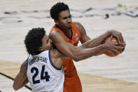 Villanova's Jeremiah Robinson-Earl, left, and Virginia Tech's Keve Aluma compete for possession of the ball during the second half of an NCAA college basketball game Saturday, Nov. 28, 2020, in Uncasville, Conn. (AP Photo/Jessica Hill)