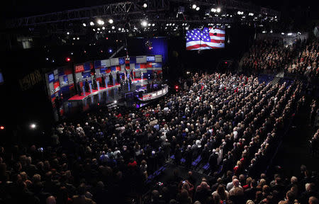 Republican U.S. presidential candidates (L-R) Governor John Kasich, Governor Chris Christie, Senator Marco Rubio, businessman Donald Trump, Senator Ted Cruz, Dr. Ben Carson and former Governor Jeb Bush listen to the U.S. National Anthem before the start of the Fox Business Network Republican presidential candidates debate in North Charleston, South Carolina January 14, 2016. REUTERS/Randall Hill