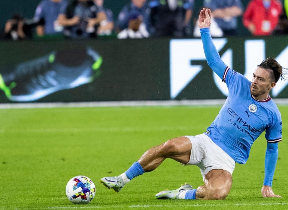 Manchester City midfielder Jack Grealish fights for the ball against FC Bayern Munich during the exhibition match on Saturday, July 23, 2022, at Lambeau Field in Green Bay, Wis.