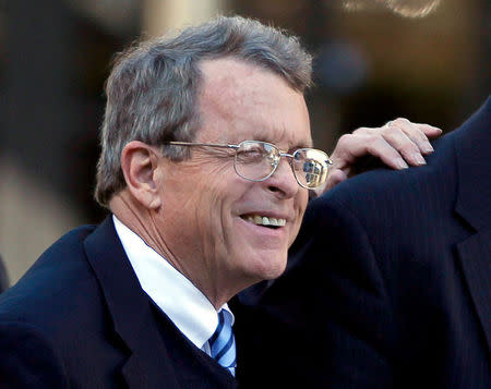 FILE PHOTO -- Ohio Attorney General Mike DeWine and Republican presidential candidate Rick Santorum (not shown) arrive for a news conference at the Ohio Statehouse in Columbus, Ohio, February 17, 2012. REUTERS/Matt Sullivan/File Photo