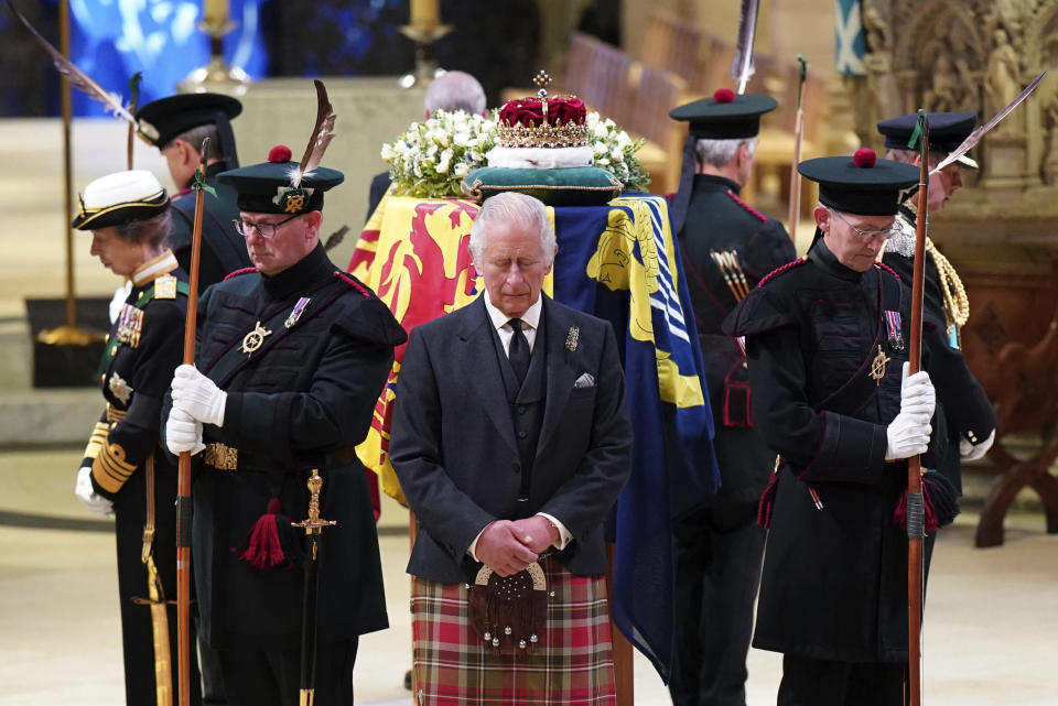 Britain's King Charles III, center, and other members of the royal family hold a vigil at the coffin of Queen Elizabeth II at St Giles' Cathedral, Edinburgh, Scotland, Monday Sept. 12, 2022. (Jane Barlow/Pool via AP)