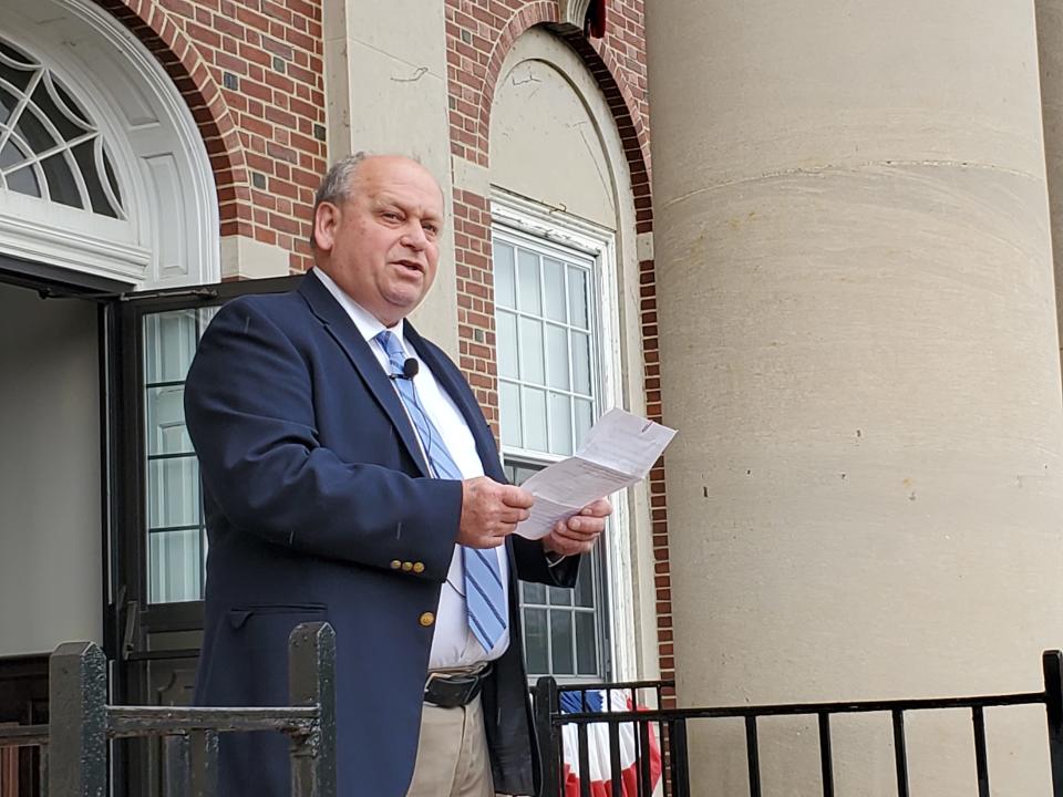 Dover Mayor Robert Carrier speaks from the steps of City Hall Sunday, the Fourth of July.