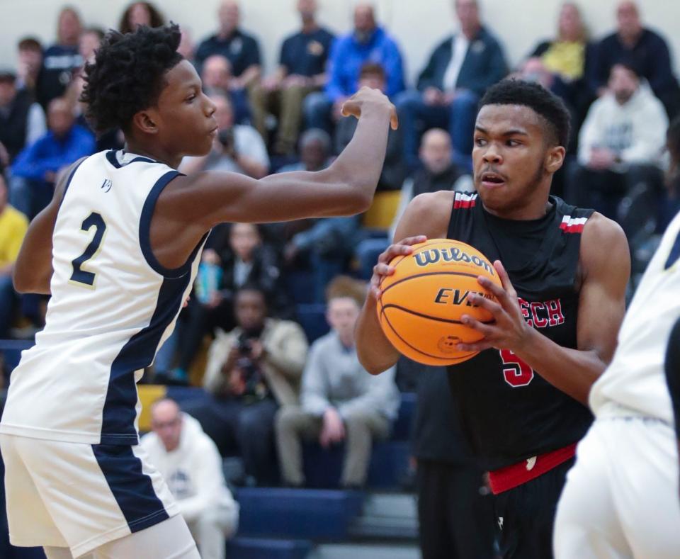 Salesianum's Kareem Thomas (left) can't get to a rebound before Polytech's Dorell Little in the first half of Salesianum's 72-53 win at home in the second round of the DIAA high school state tournament, Thursday, March 2, 2023.