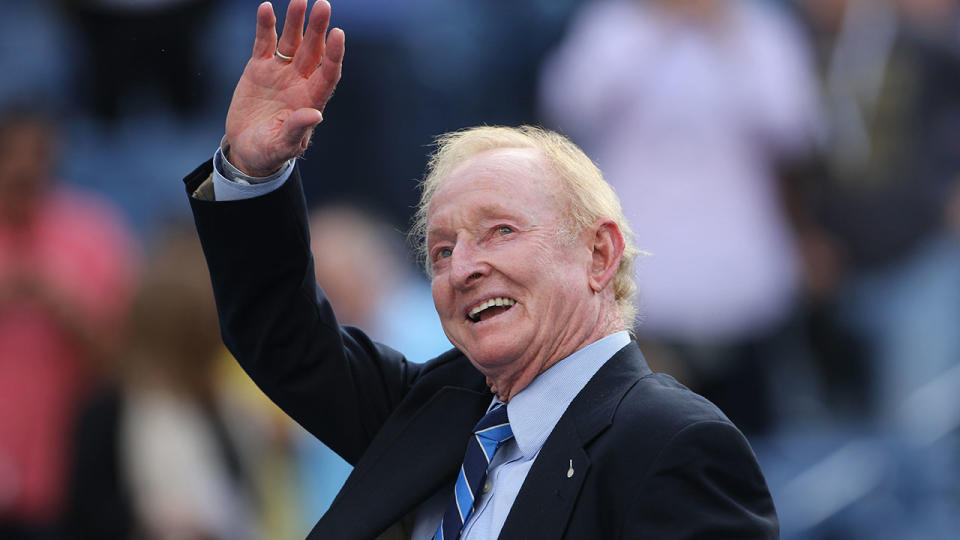 Pictured here, Rod Laver waves to the crowd during a Grand Slam match.