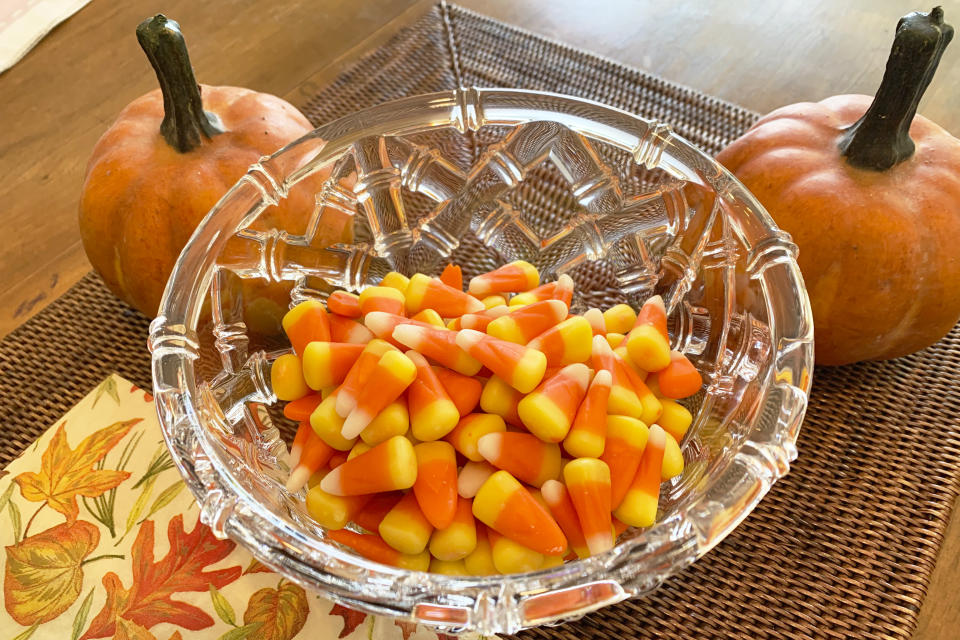 This image shows a bowl of candy corn in Westchester County, N.Y. on Oct. 23, 2023. Cruel joke for trick-or-treaters or coveted seasonal delight? The great Halloween debate over candy corn is on. (AP Photo/Julia Rubin)