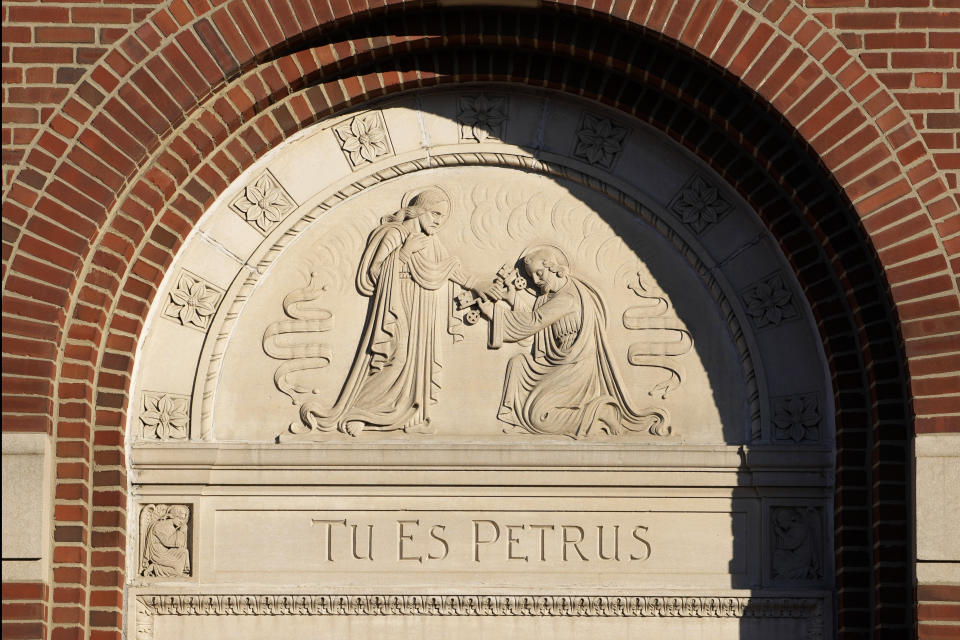 An archway at St. Peter's Church is seen Saturday, May 6, 2023, in Portland, Maine. The inscription is Latin for "Thou art Peter." A change in statute of limitations laws has allowed several women who claim to be victims of sexual abuse at St. Peter's from 1958 to 1967 to sue the Roman Catholic Diocese of Portland. (AP Photo/Robert F. Bukaty)