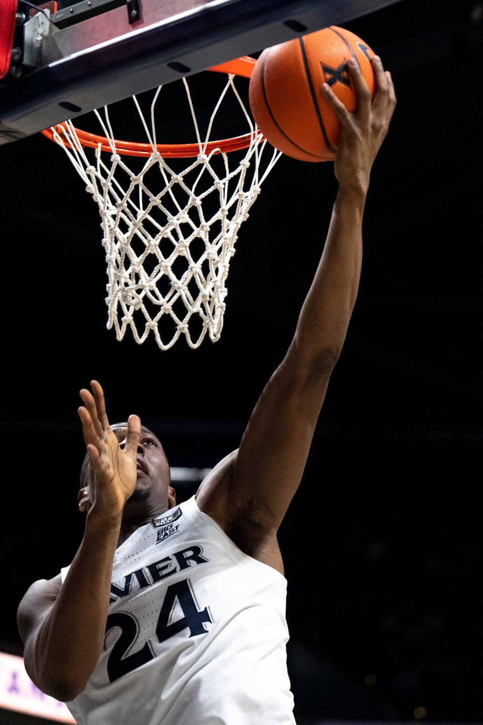 Xavier Musketeers forward Abou Ousmane (24) hits a layup in the first half of the basketball game between Xavier Musketeers and Seton Hall Pirates at the Cintas Center in Cincinnati on Saturday, Dec. 23, 2023.