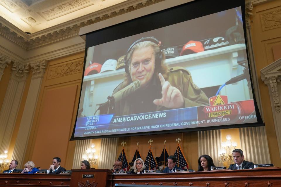 A video of former Trump chief strategist Steven Bannon talking about the Capitol riot on Jan. 6, 2021, is played at the House hearing on July 12, 2022.