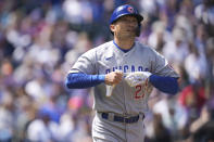 Chicago Cubs' Seiya Suzuki heads to first base after drawing a walk from Colorado Rockies starting pitcher Austin Gomber in the second inning of a baseball game, Sunday, April 17, 2022, in Denver. (AP Photo/David Zalubowski)