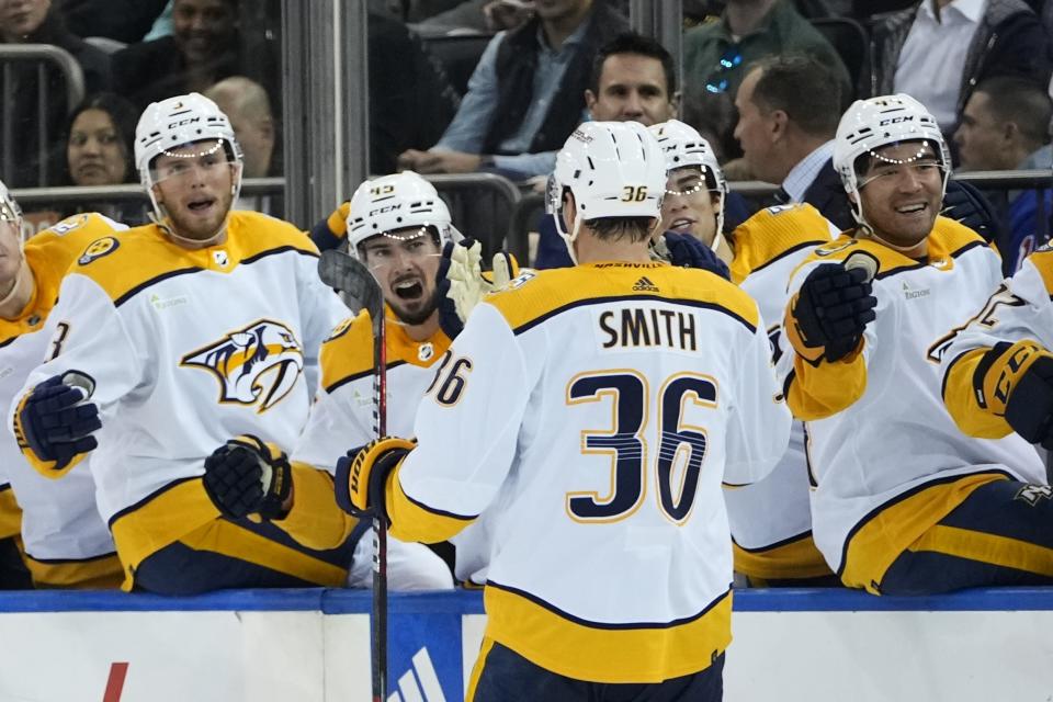 Nashville Predators' Cole Smith (36) celebrates with teammates after scoring a goal during the first period of an NHL hockey game against the New York Rangers, Thursday, Oct. 19, 2023, in New York. (AP Photo/Frank Franklin II)